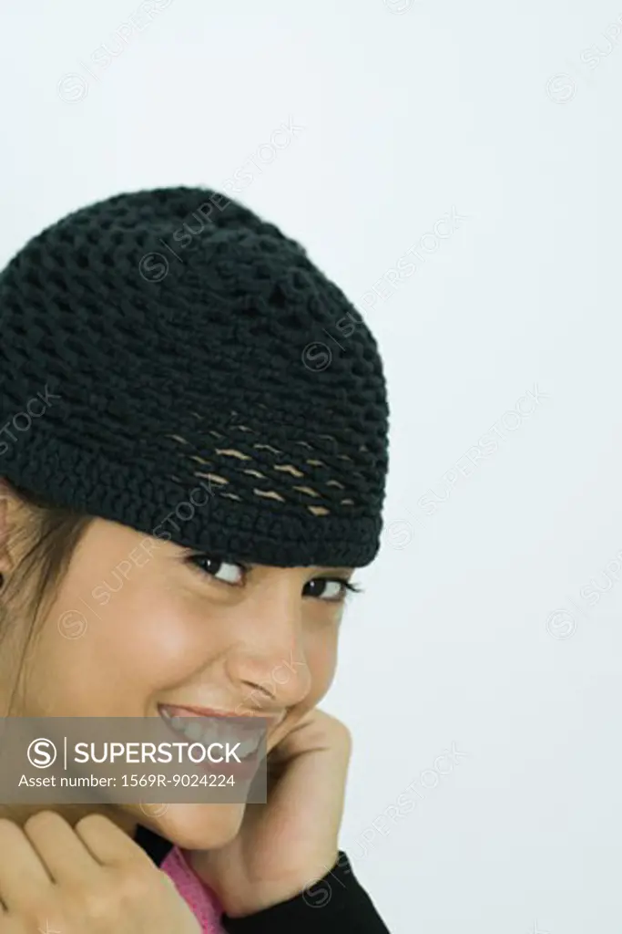 Teenage girl wearing knit hat, portrait