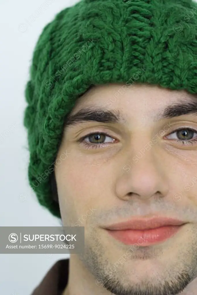 Young man wearing knit hat, portrait