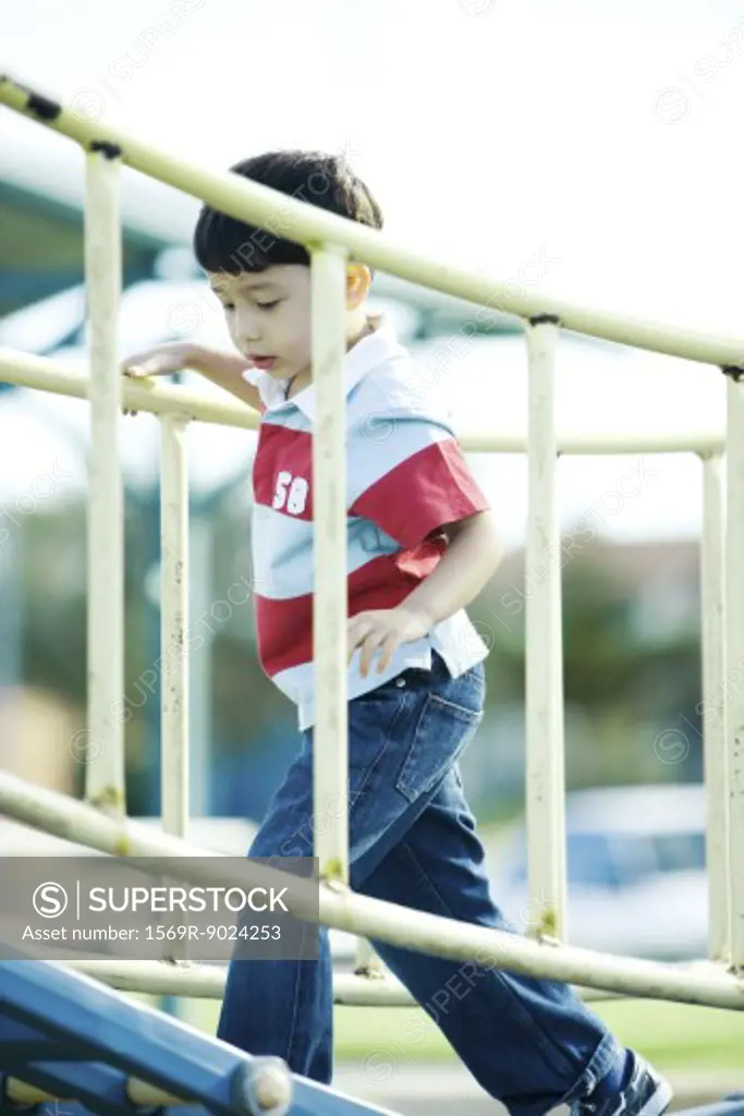 Boy on playground equipment