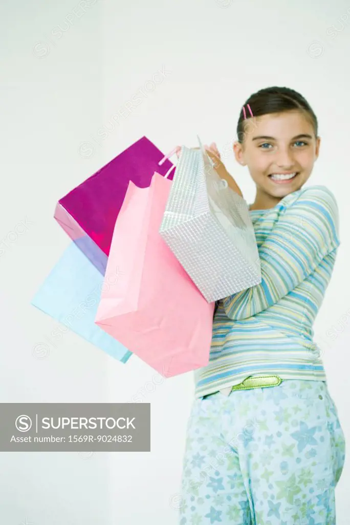 Girl holding up shopping bags