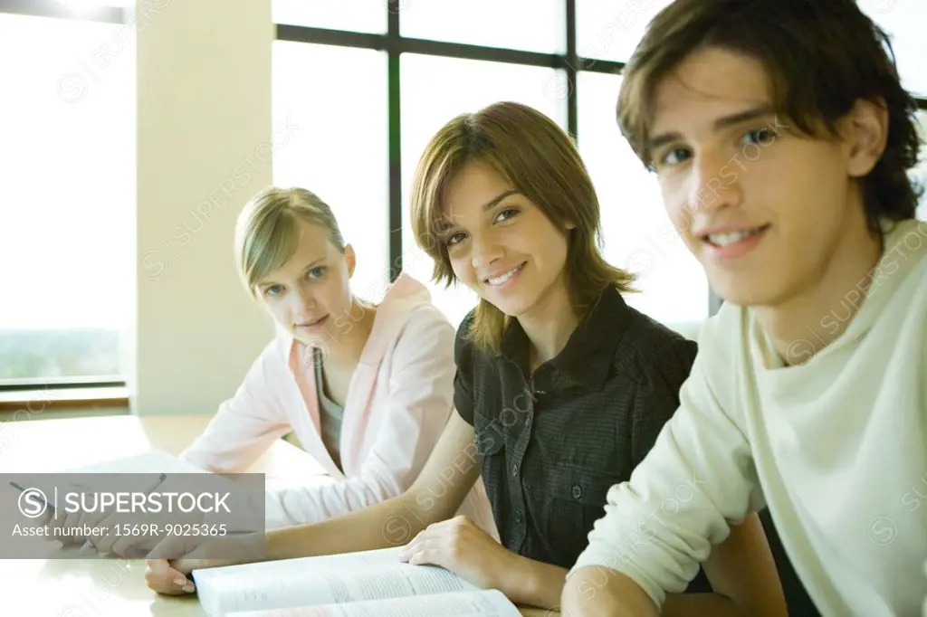 Students studying together, looking at camera, portrait