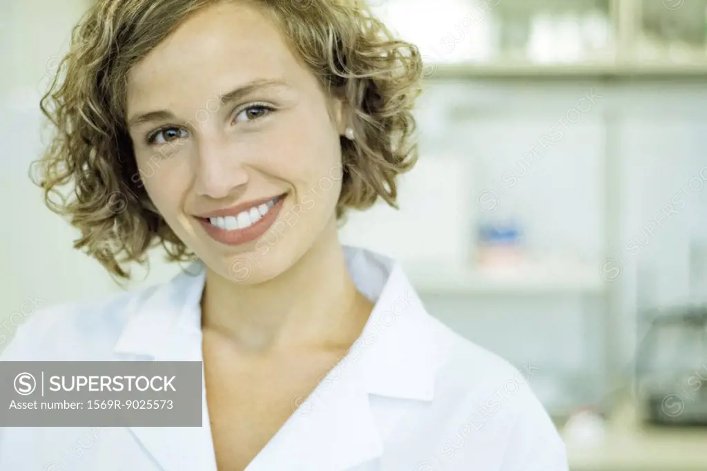 Female doctor smiling at camera, portrait