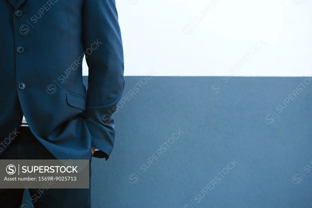 Cropped view of businessman, hand in pocket, close-up