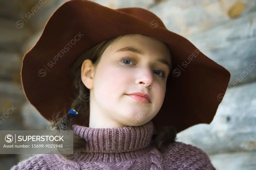 Teenage girl wearing turtleneck and hat, portrait