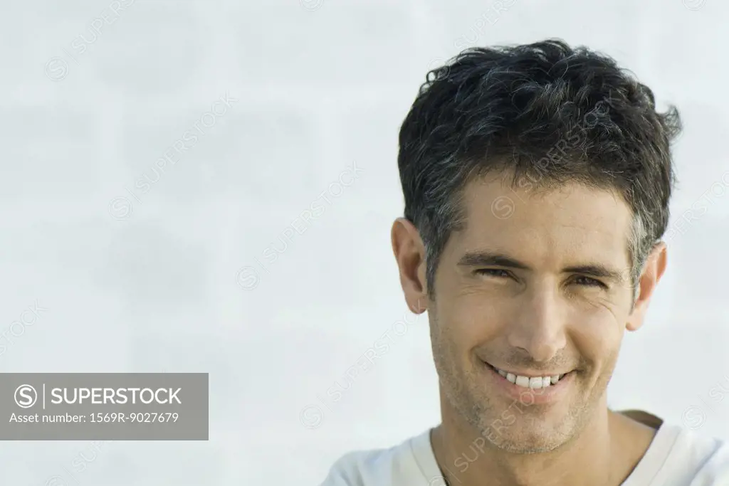 Mature man smiling at camera, portrait