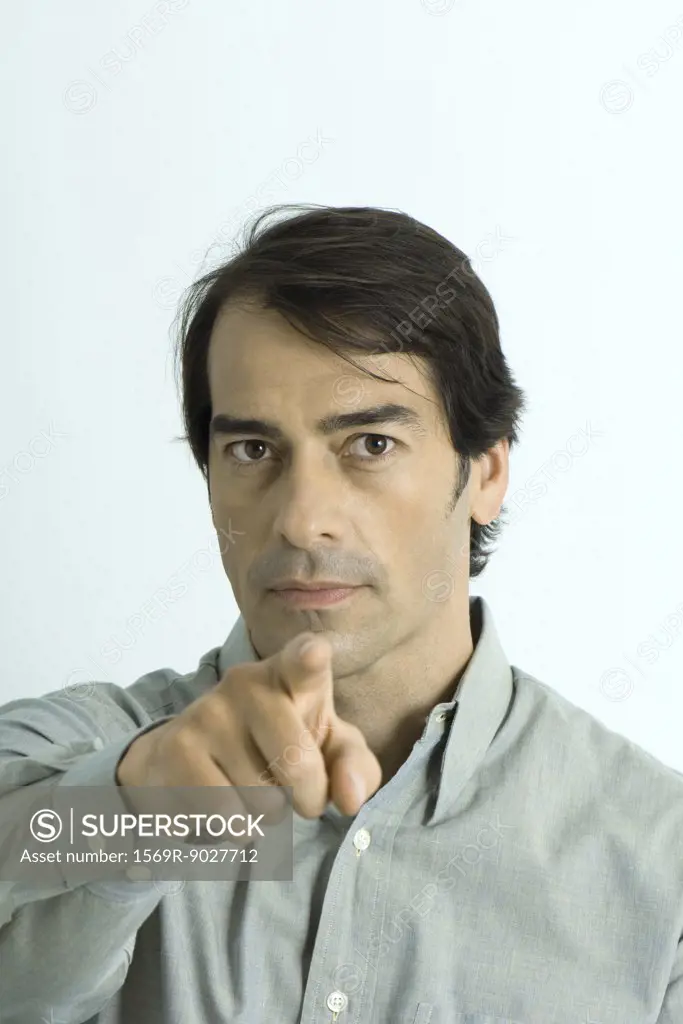 Man pointing at camera, portrait