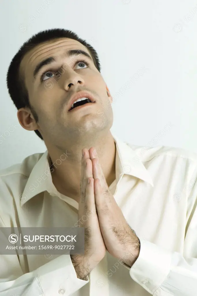 Man praying, looking up