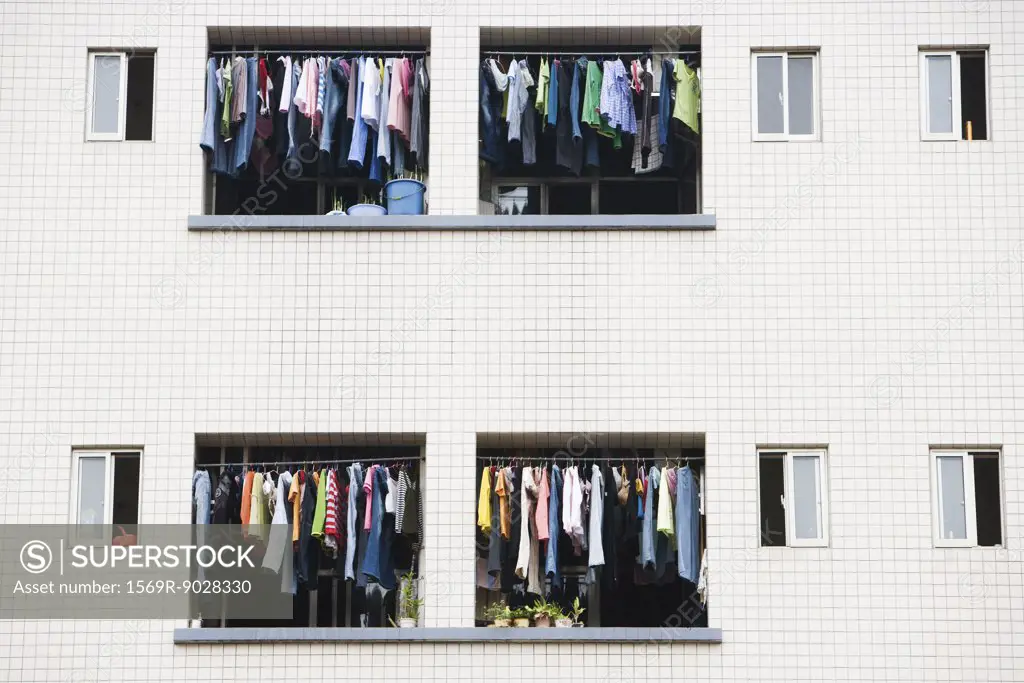 Laundry hanging to dry in balconies of apartment building