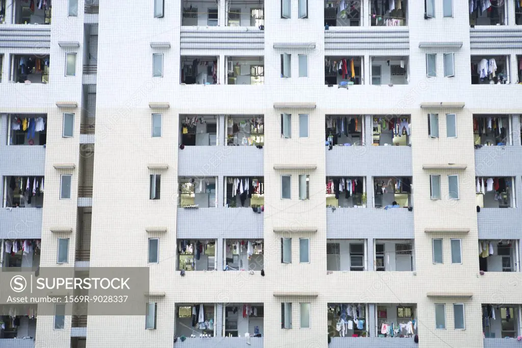 High rise apartment building, laundy hanging out to dry on balconies