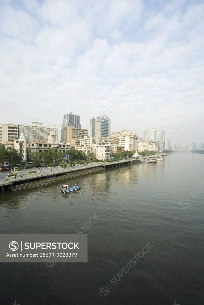 China, Guangdong Province, Guangzhou, cityscape seen from water