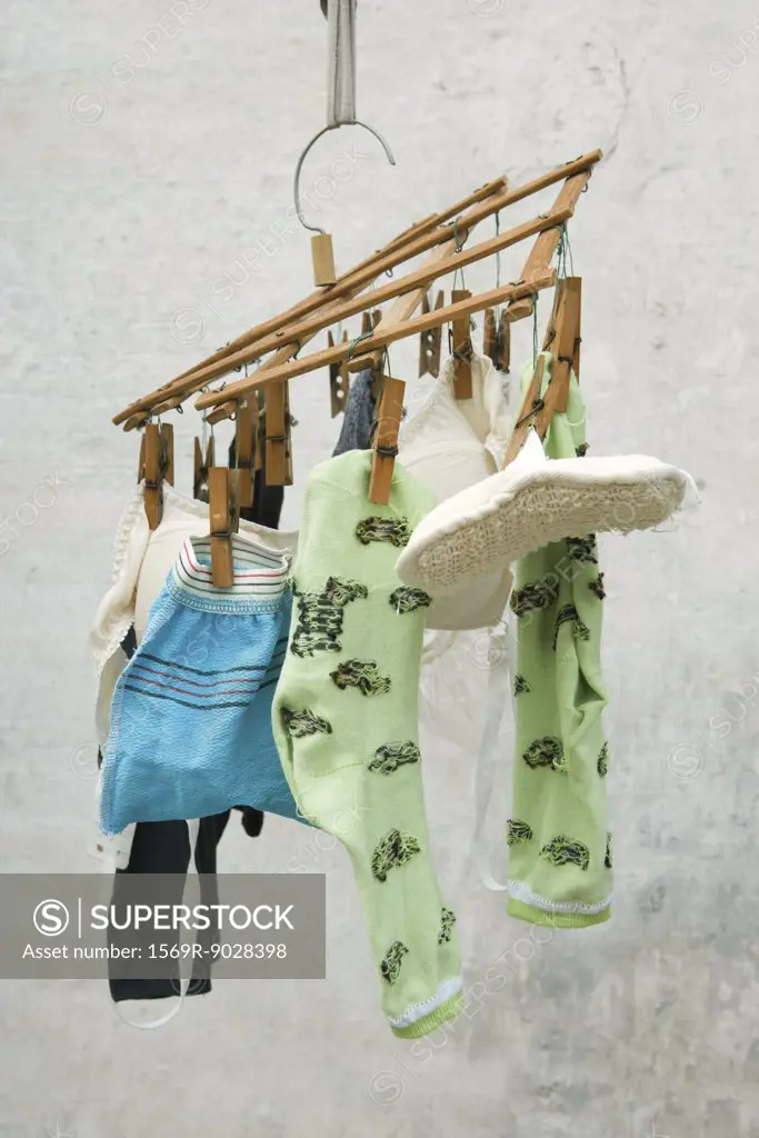 Laundry drying, hanging from small rack