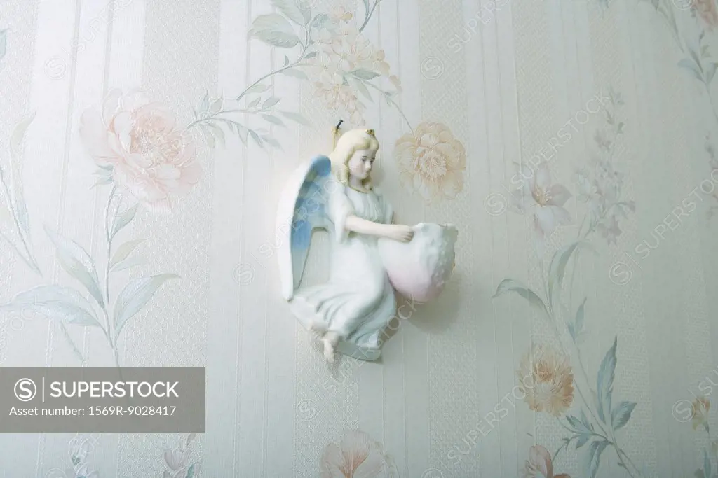 Angel knickknack hanging on wall
