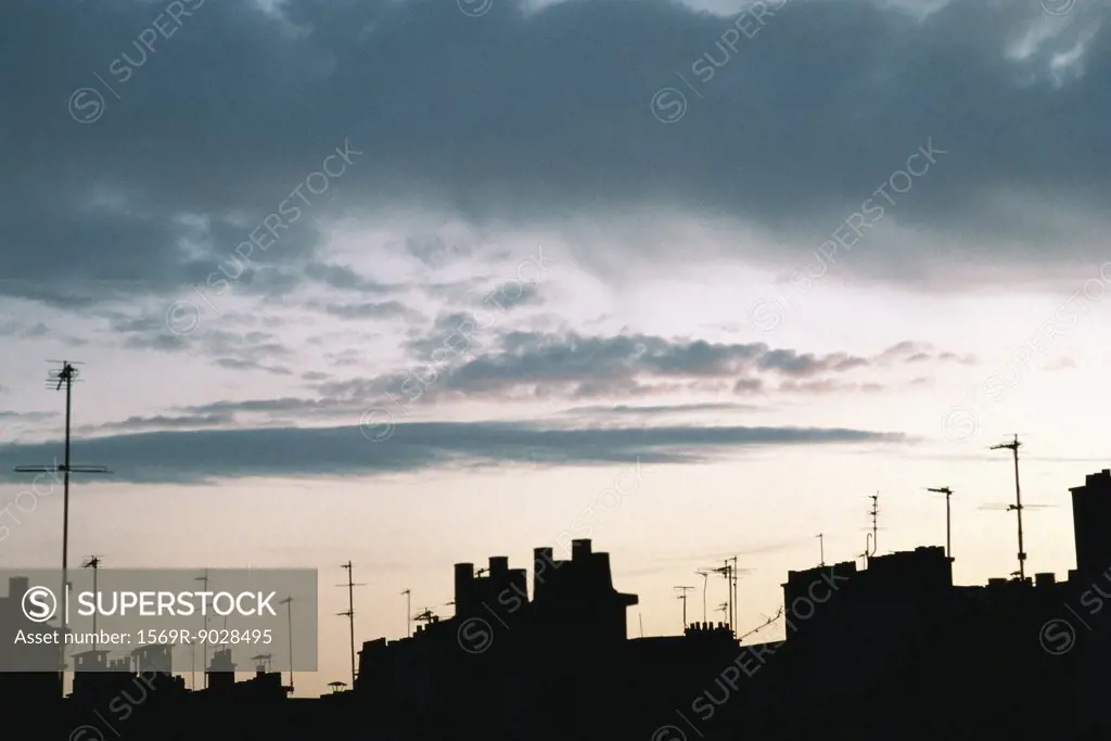 Roofline silhouetted against sky at twilight