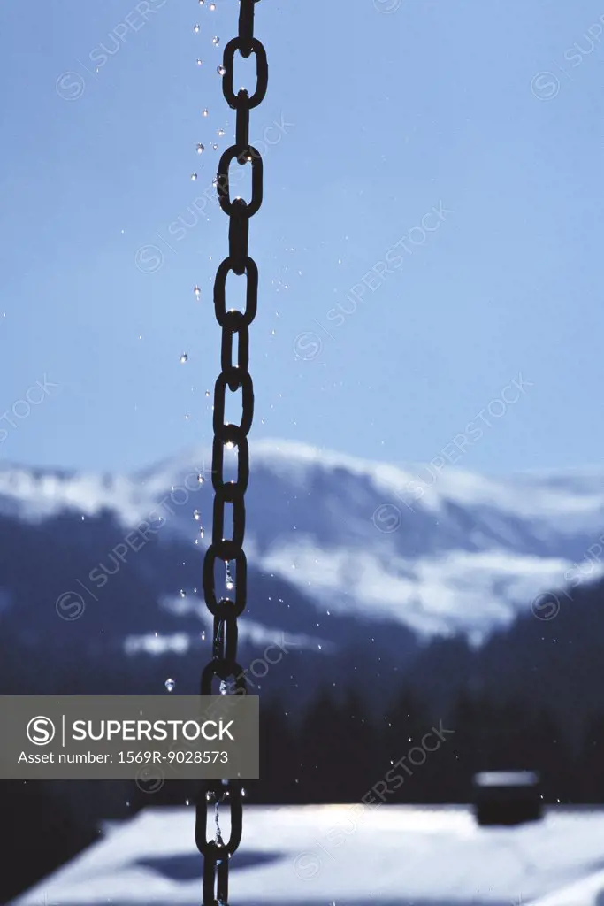 Chain, mountain landscape in background
