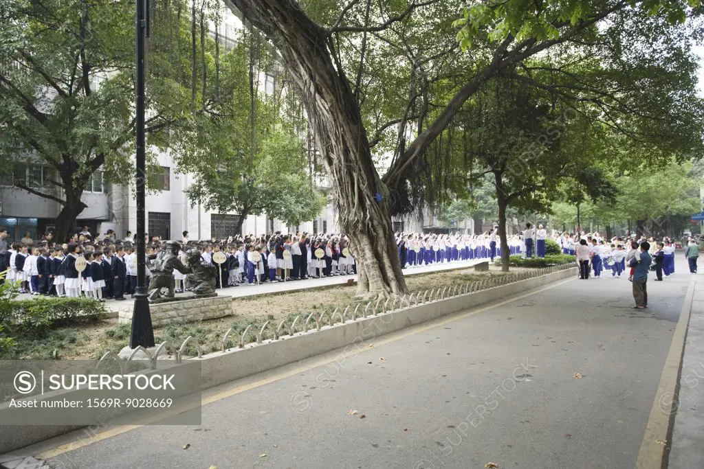 China, Guangdong Province, Guangzhou, students assembled outside