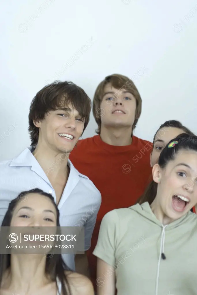 Group of young friends posing for photo, smiling at camera, portrait