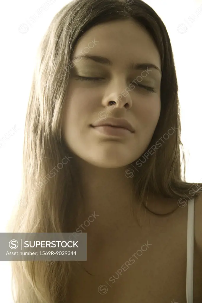 Young woman eyes closed, portrait, close-up