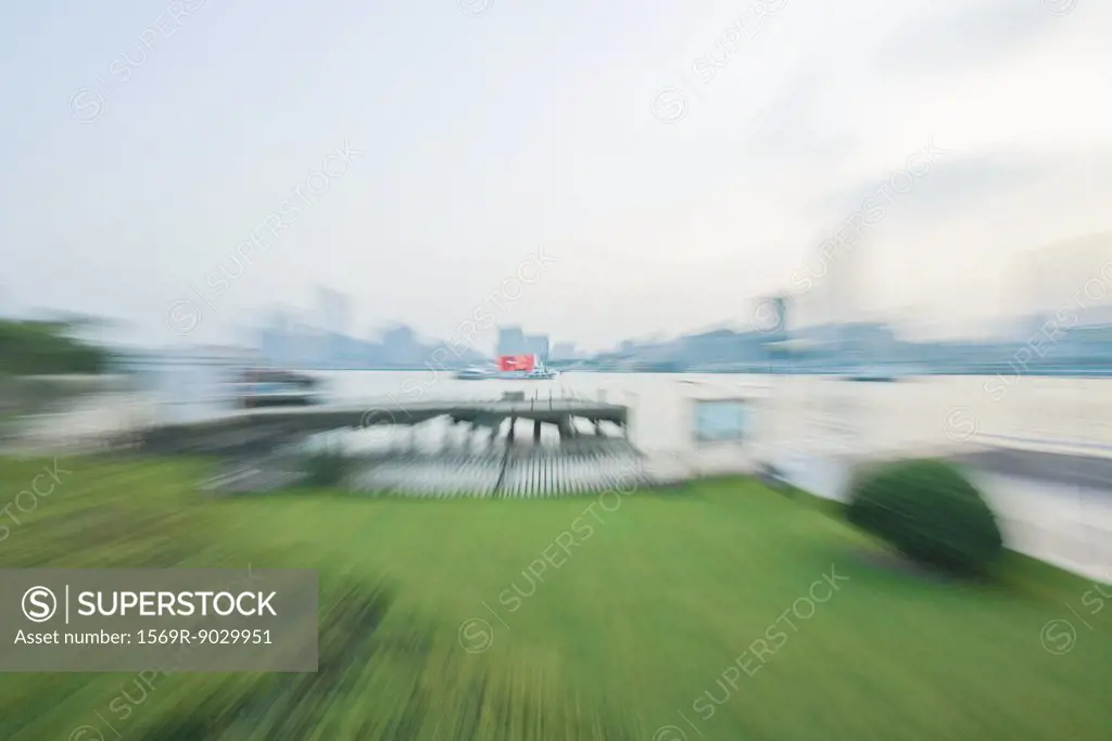 Green space next to waterfront, blurred