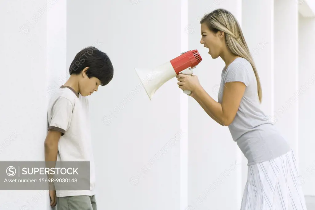 Woman shouting at boy through megaphone