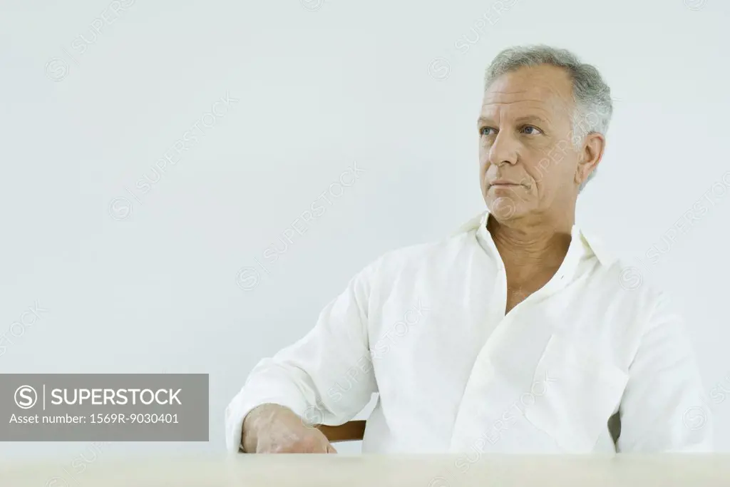 Mature man looking away, portrait