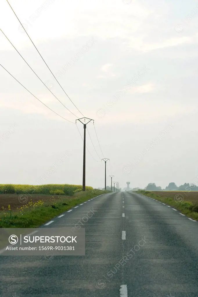 Road and telephone lines in countryside