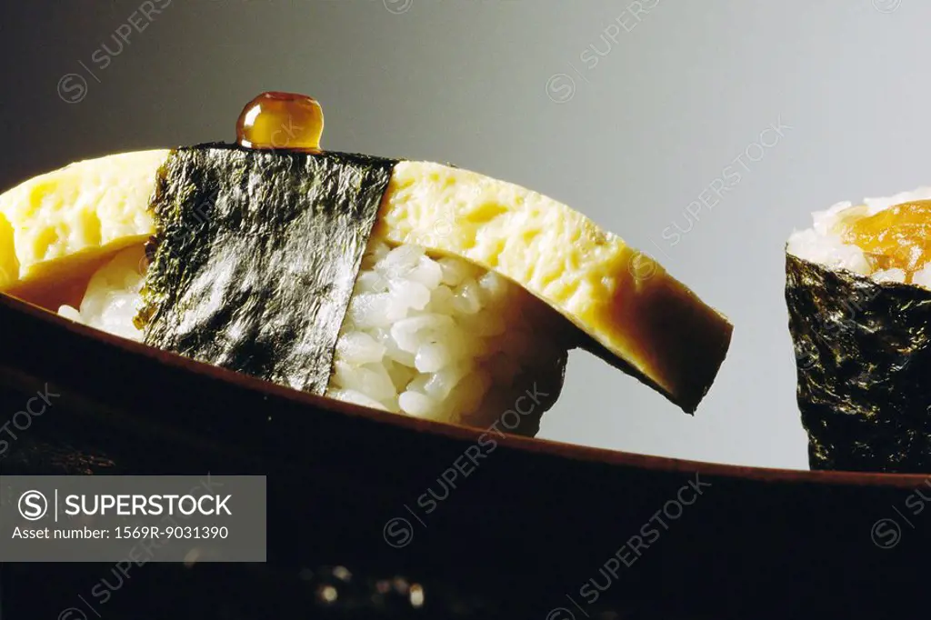Tamago sushi with fish roe, extreme close-up