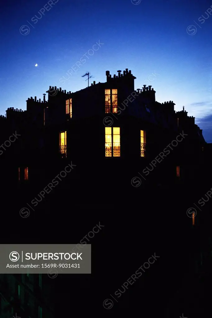 Apartment building at night, silhouette