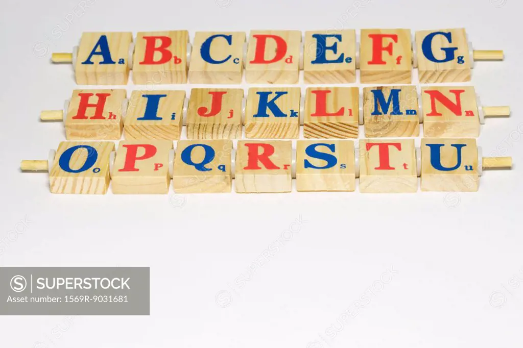 Wooden alphabet blocks in rows, close-up