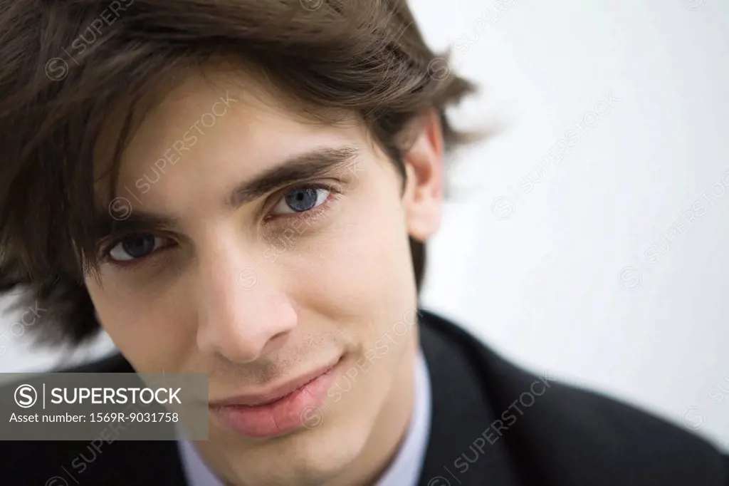 Young man smiling at camera, portrait