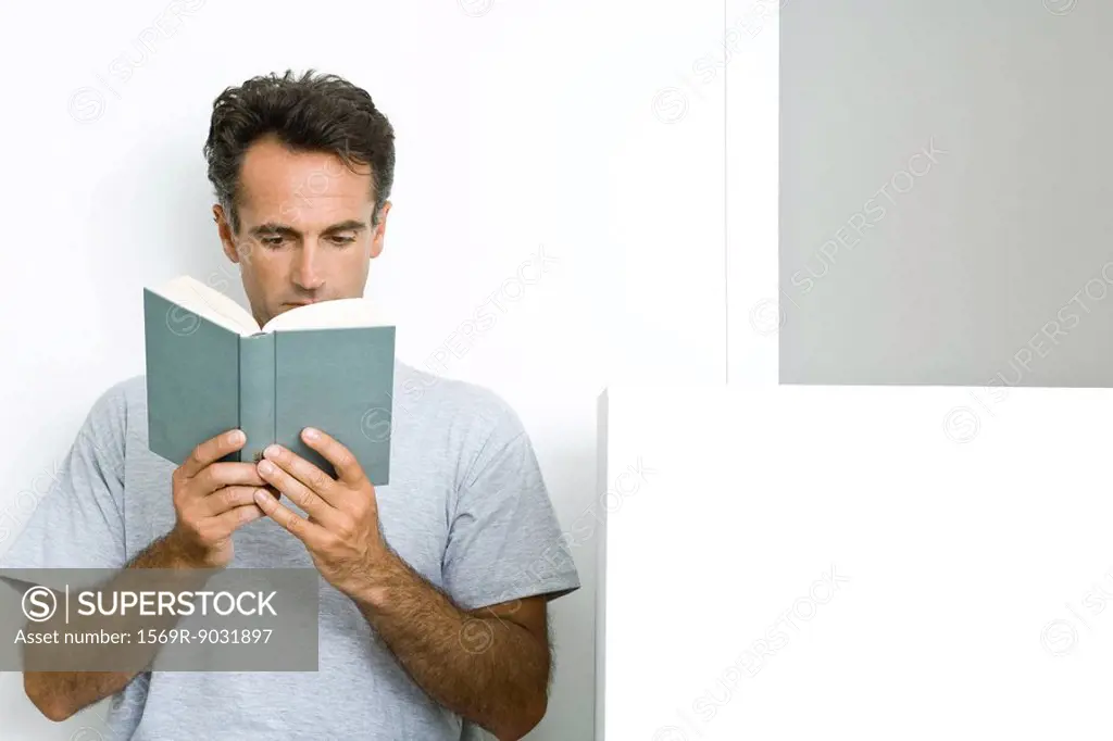 Man reading book, front view