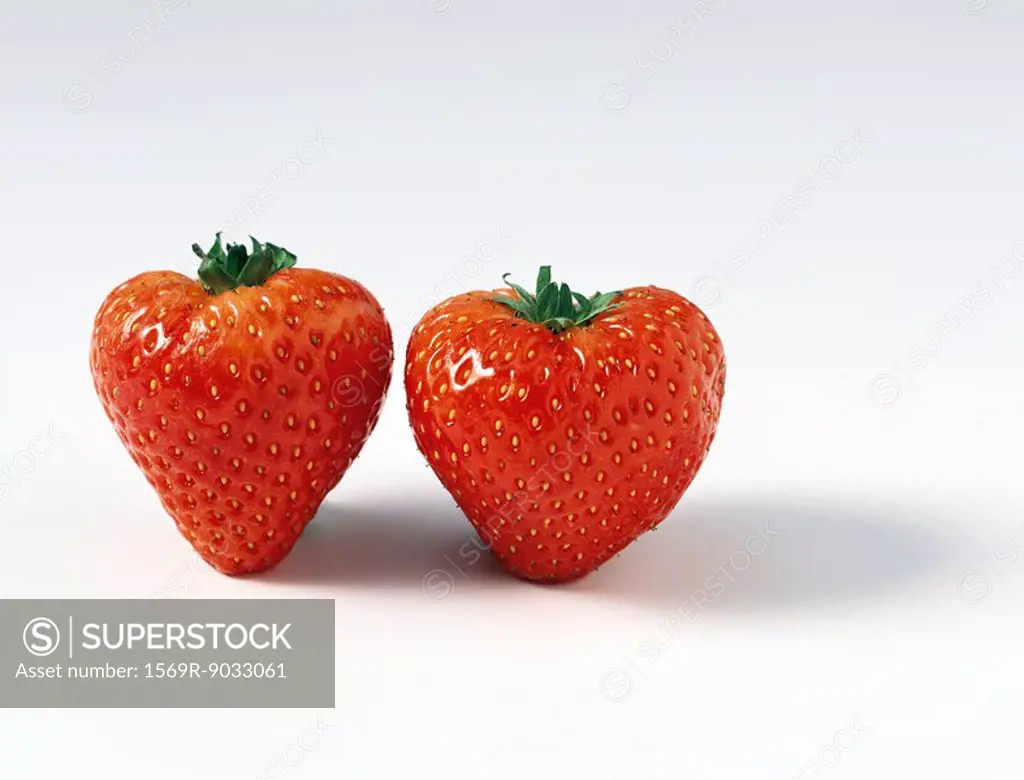 Two ripe strawberries, close-up