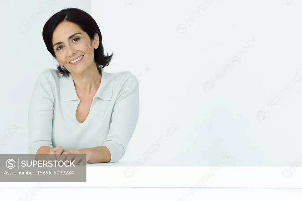 Mature woman, smiling at camera, portrait