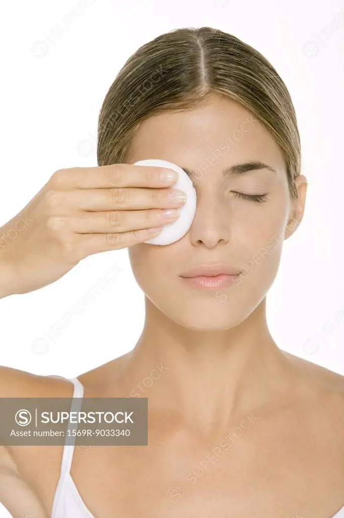 Woman removing eye make-up