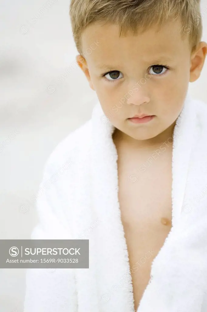 Little boy wrapped in towel, looking at camera, portrait