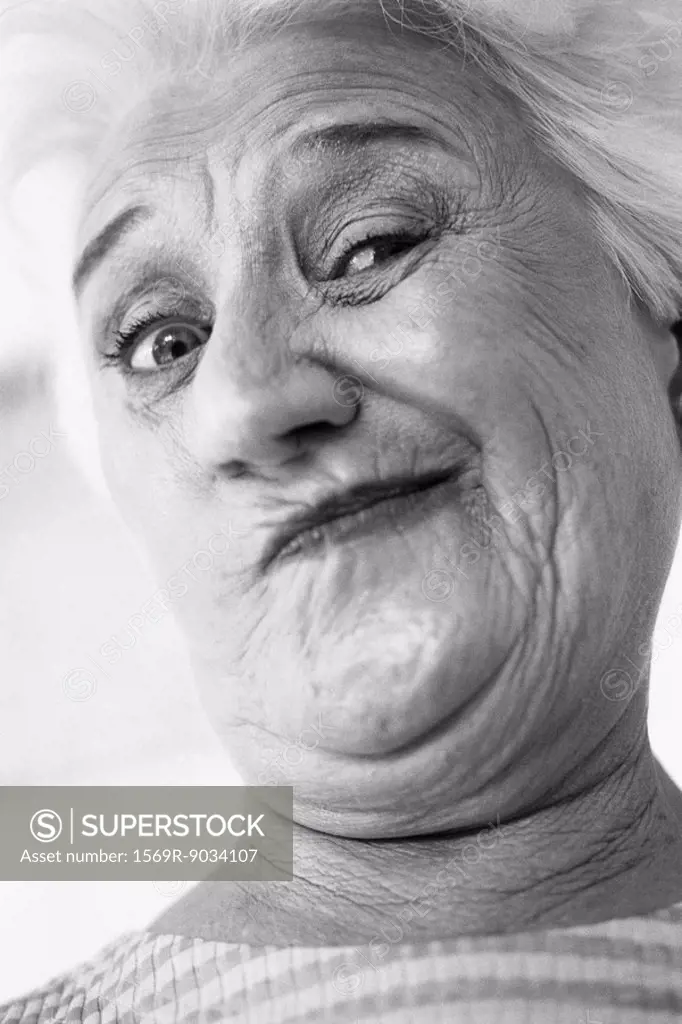 Senior woman making face at camera, portrait