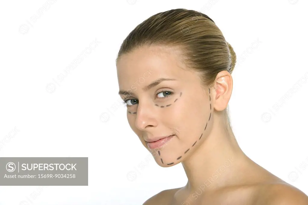 Woman with plastic surgery markings on face, smiling at camera