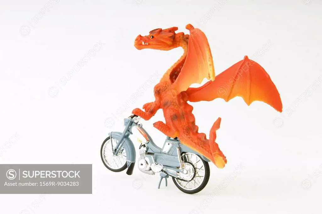 Toy dragon riding motorbike