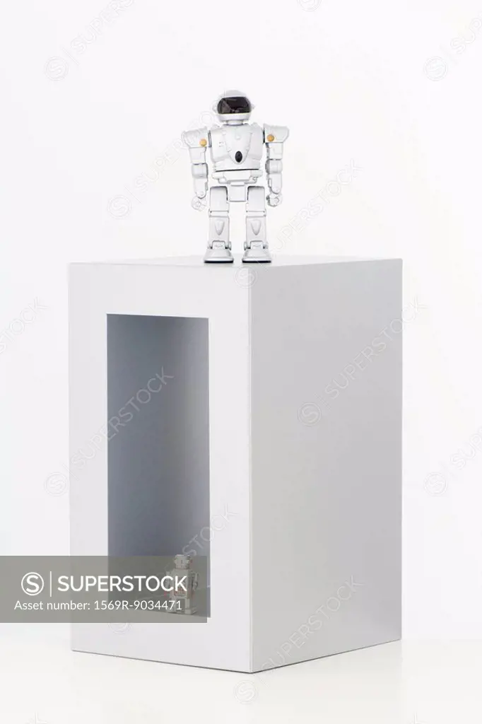 Two robots, one inside box, the other on top of box