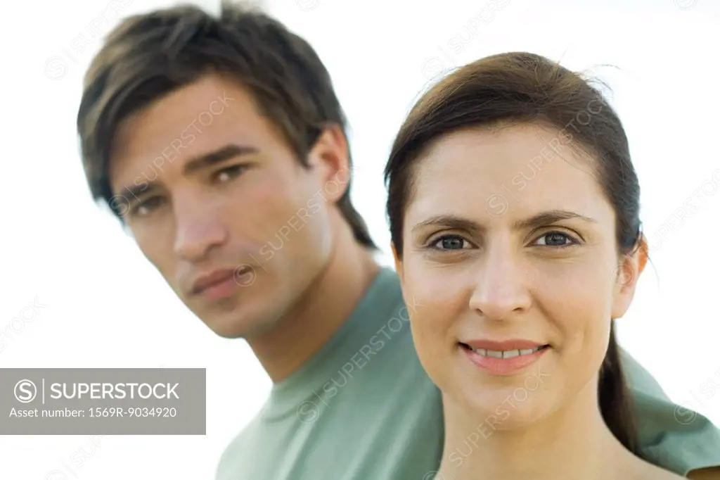 Couple looking at camera, woman smiling
