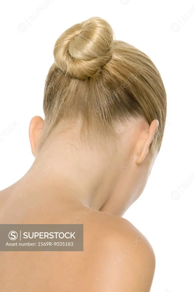 Blonde woman with hair arranged in chignon, rear view