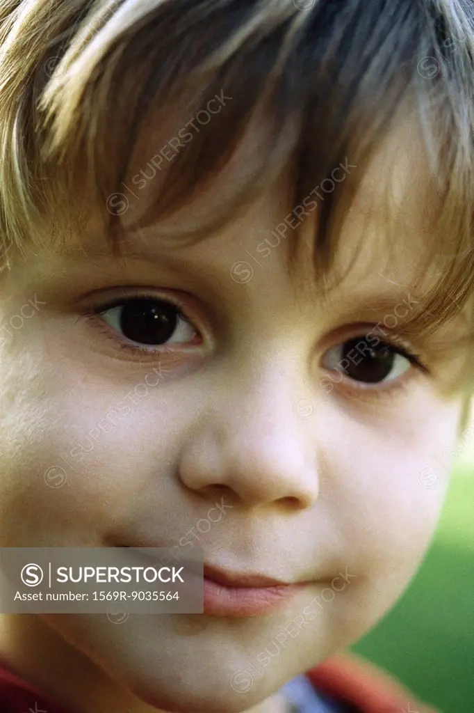 Little boy smiling at camera, headshot, portrait