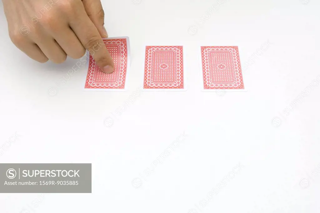 Hand turning over card