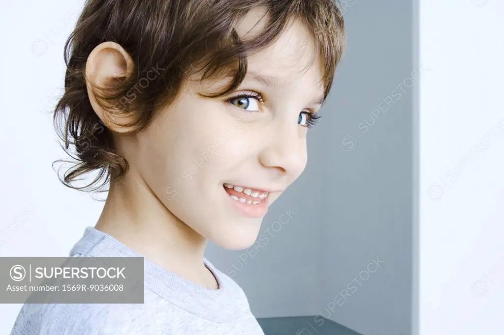 Boy smiling at camera, head and shoulders, portrait