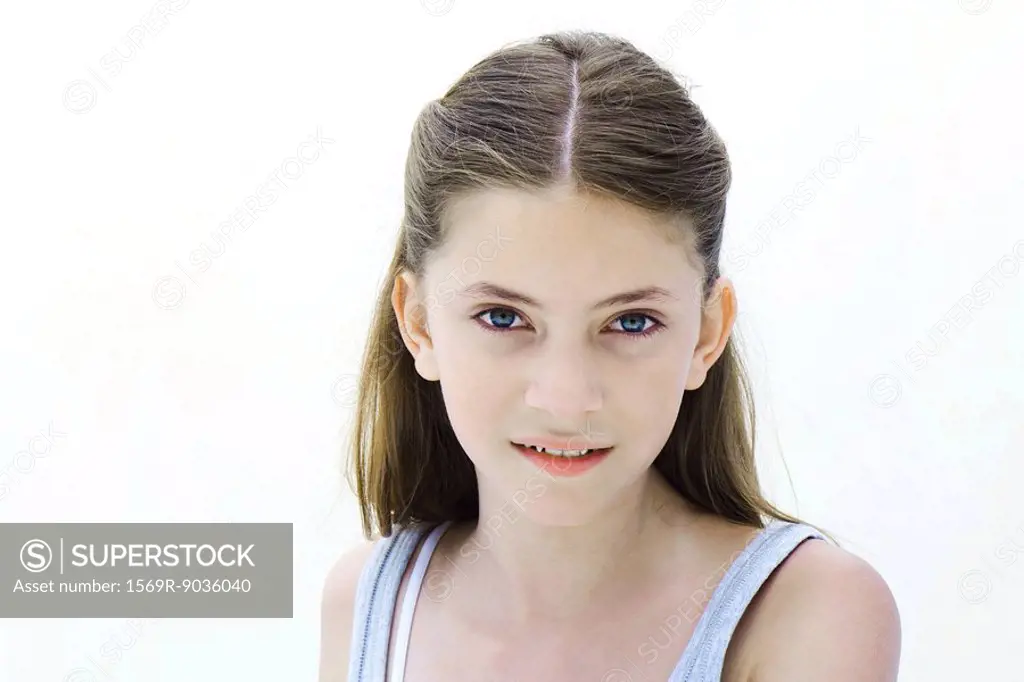 Preteen girl smiling at camera, portrait