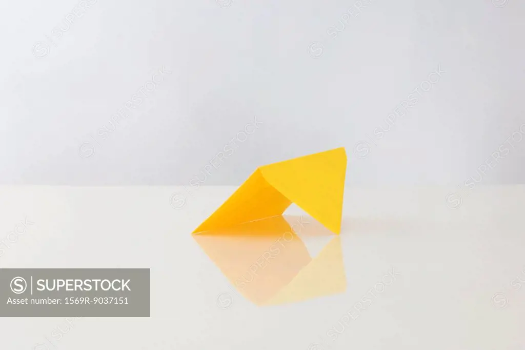 Yellow envelope propped up on table