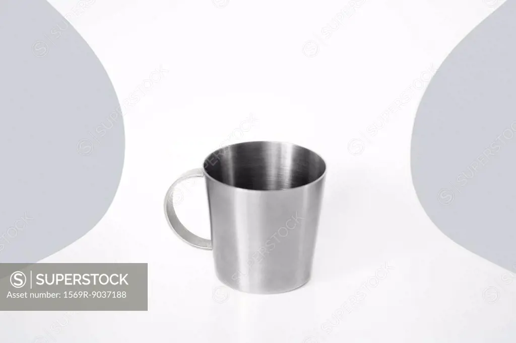 Metal cup on a chair, close-up