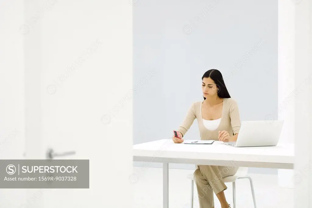 Businesswoman working alone in empty office