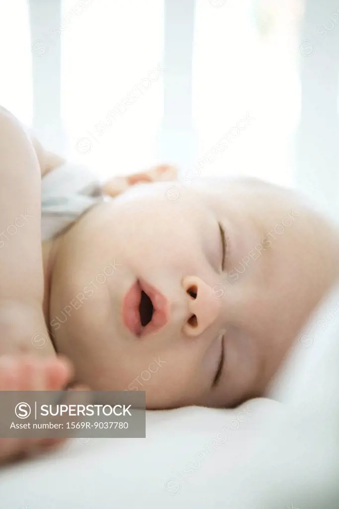 Baby sleeping with mouth open, close-up
