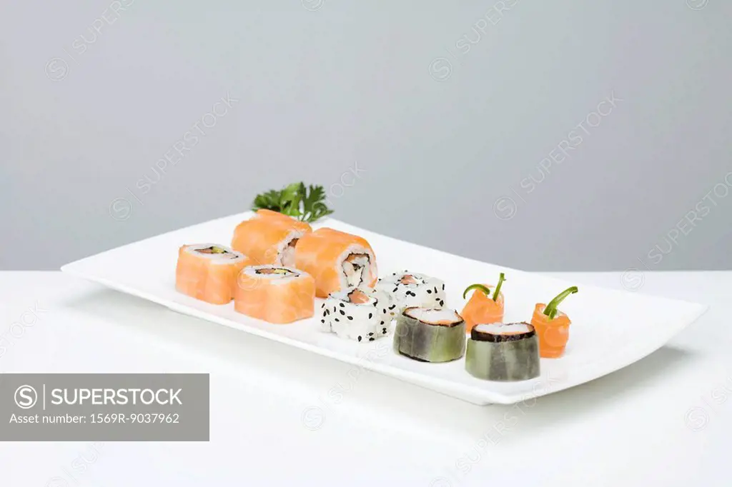 Assorted maki sushi arranged on sushi plate