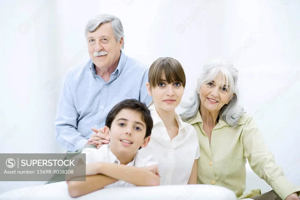Woman with senior parents and preteen son, portrait